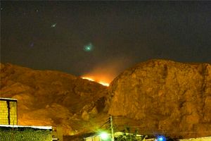 طاق بستان در میان شعله های آتش