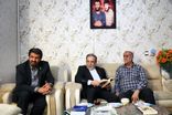 دیدار عراقچی با خانواده شهیدان حاجی‌بابایی در همدان