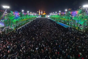برگزاری جشن میلاد امام زمان (عج) در هوای بارانی کربلا + فیلم